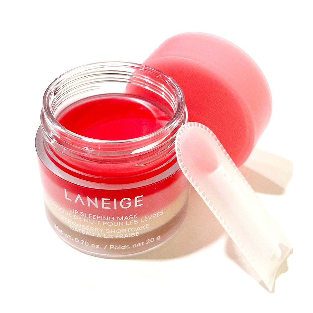 Laneige Lip Sleeping Mask in a clear glass jar with a pink cap, shown open with a white applicator on a white background.