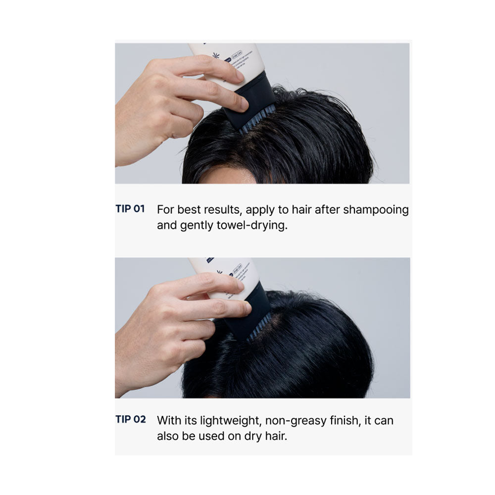 Person applying hair product with a brush on a gray background