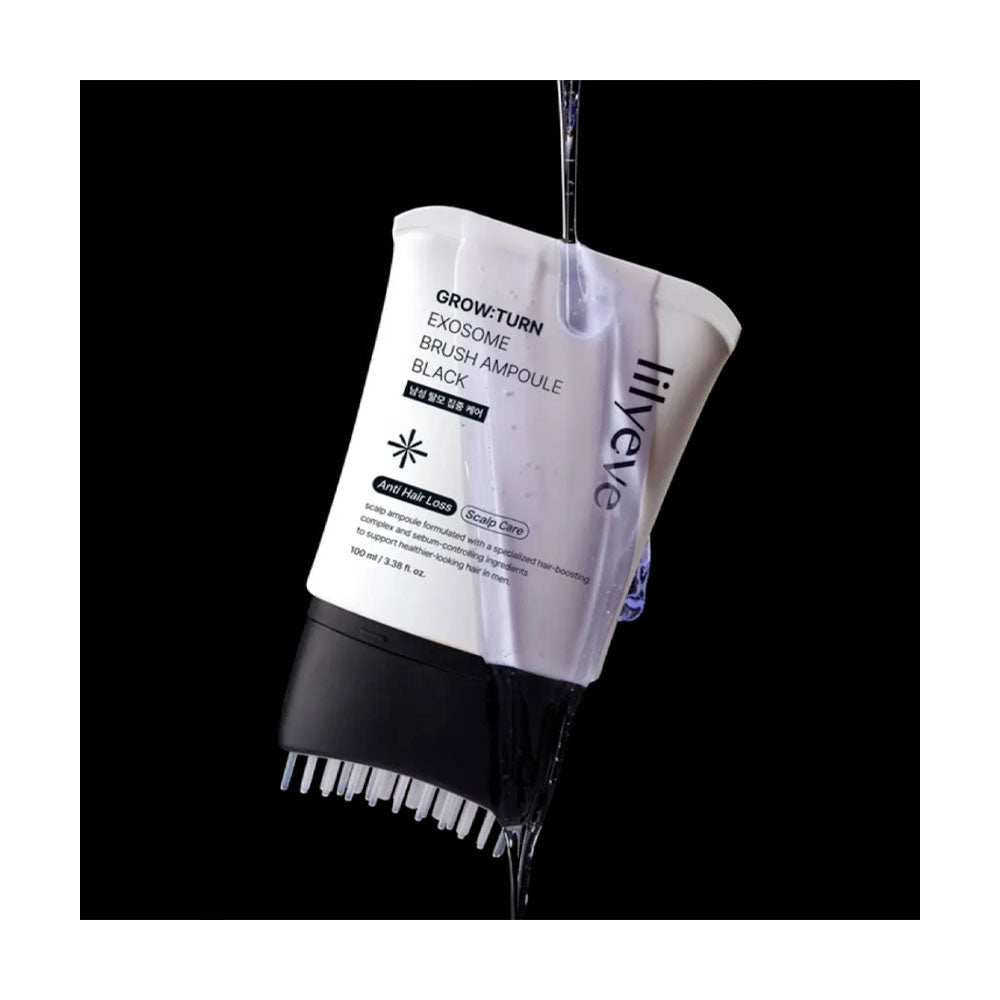 Black and white hairbrush with a white container labeled 'lilyeve' on a black background