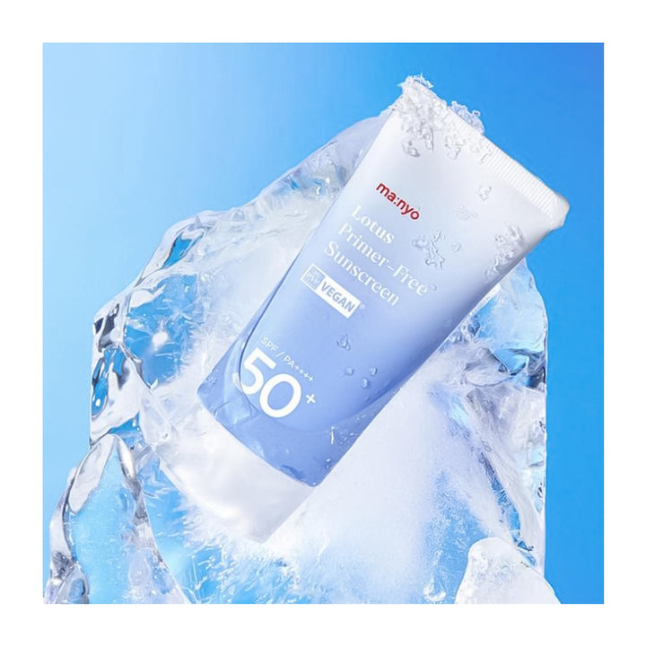 A tube of Manyo Lotus Primer-Free Sunscreen SPF 50+ with a light blue-to-white gradient, nestled in ice cubes against a bright blue background.