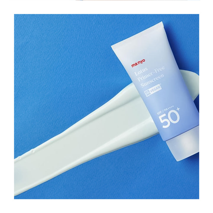 A tube of Maryo Lotus Primer-Free Sunscreen with SPF 50+ placed diagonally on a textured blue background with a diagonal smear of white sunscreen cream.