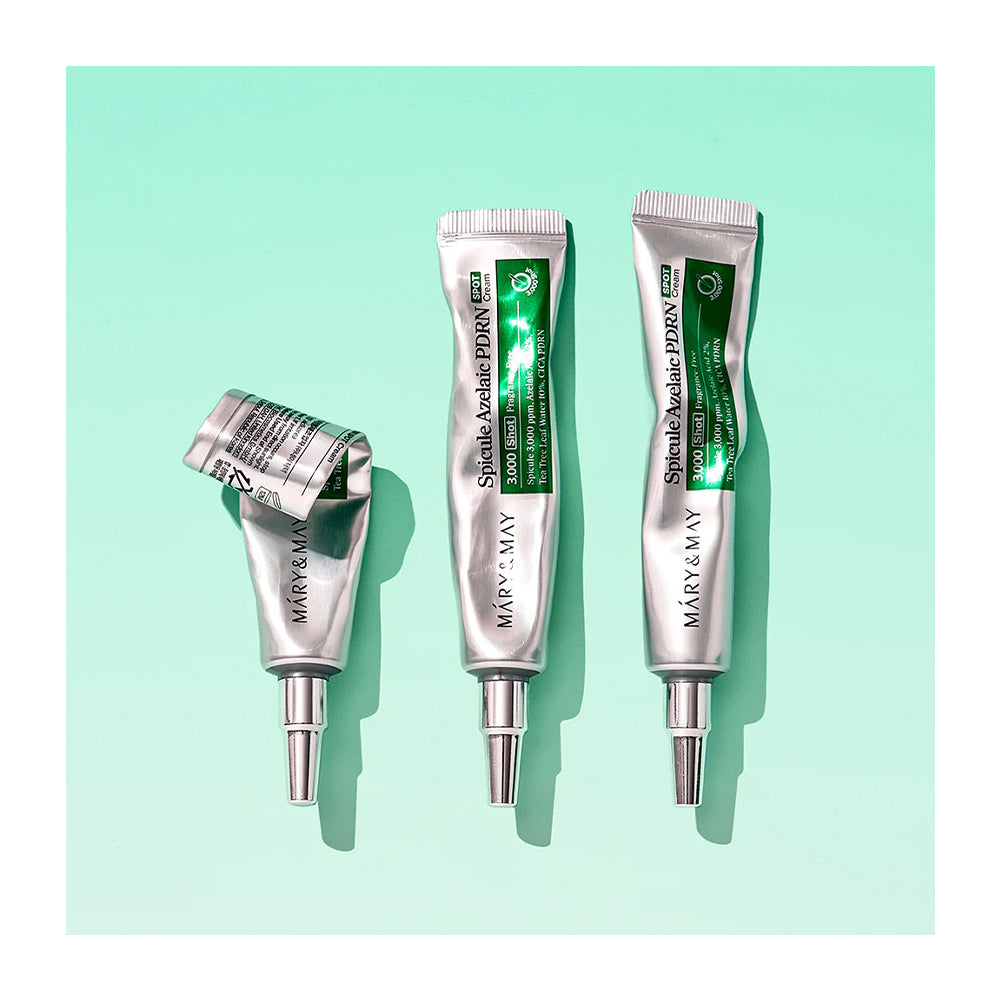Three silver squeeze tubes of Méry &amp; May Special Eczema Relief cream are arranged on a mint green background, with one tube lying on its side and the other two standing upright.