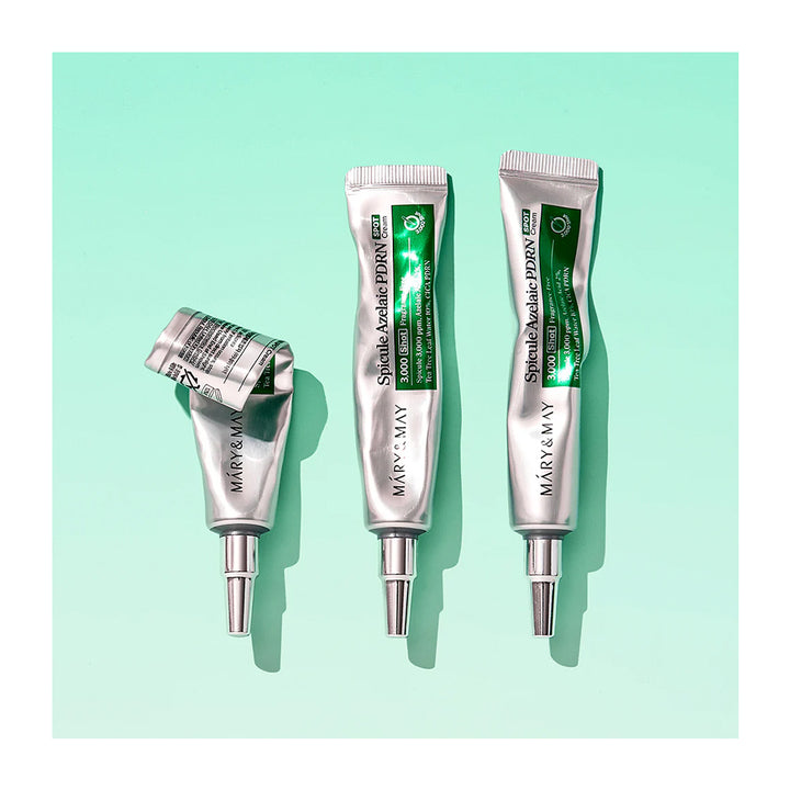 Three silver squeeze tubes of Méry &amp; May Special Eczema Relief cream are arranged on a mint green background, with one tube lying on its side and the other two standing upright.