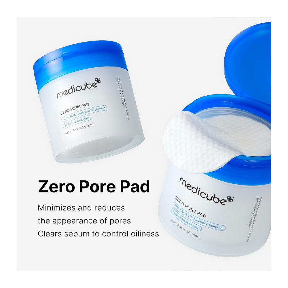 Medicube Zero Pore Pad shown in two white jars with bright blue lids on a light gray background, one jar open to reveal a white pad and one closed. Text below reads &