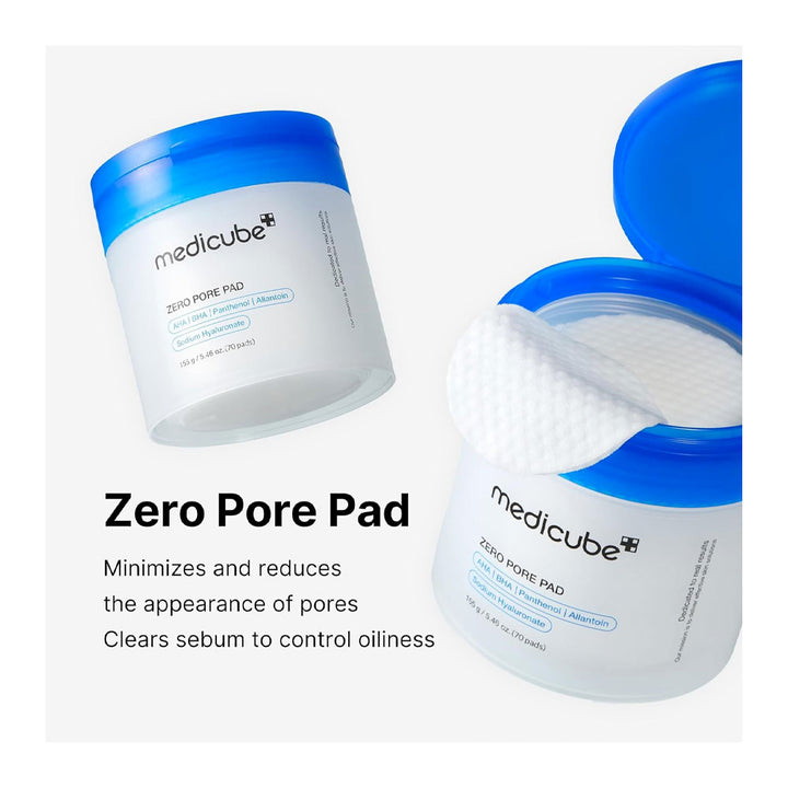 Medicube Zero Pore Pad shown in two white jars with bright blue lids on a light gray background, one jar open to reveal a white pad and one closed. Text below reads &