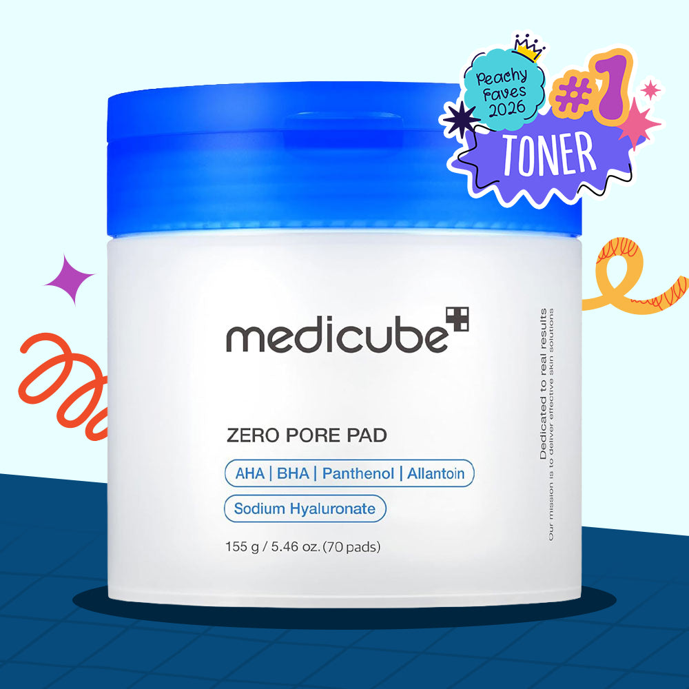 A white jar of medicube Zero Pore Pad Toner with a bright blue lid, shown on a light blue background with a dark blue grid at the bottom. A purple and orange '#1 TONER' badge is in the top right corner.