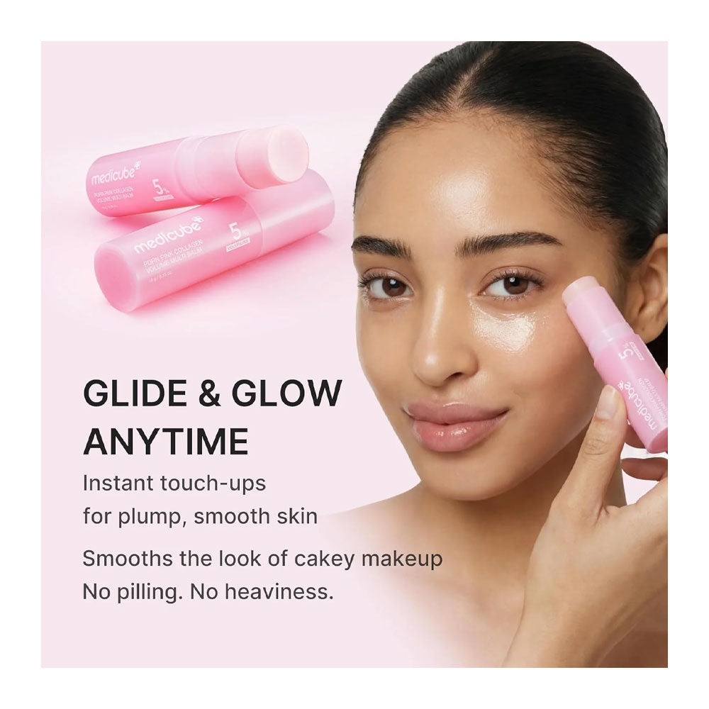A woman applies a pink makeup stick to her cheek in a close-up beauty shot. Two matching pink makeup sticks are shown in the upper left, with marketing text reading 'GLIDE & GLOW ANYTIME' and additional product benefits on a soft pink background.