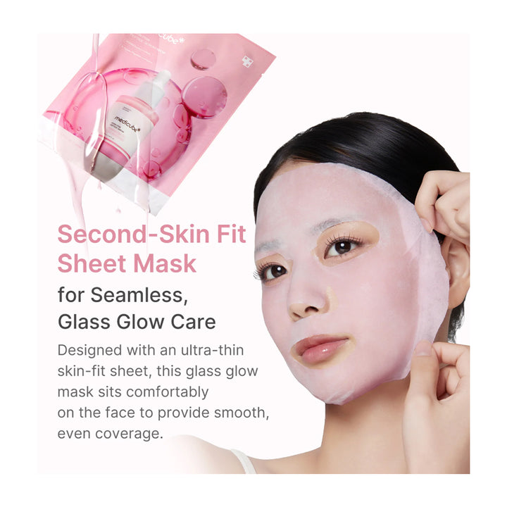 A woman wearing a translucent pink sheet mask on her face, with a pink pouch of the mask and decorative text on a white background. Text reads: &