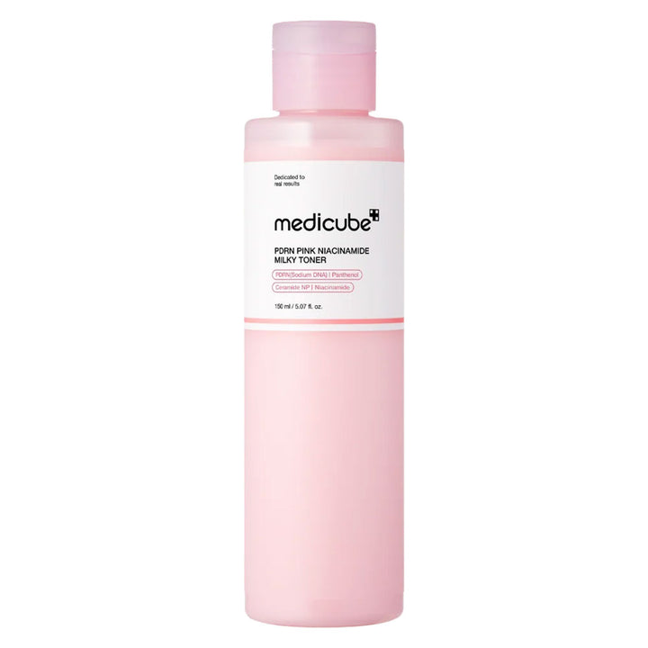 A bottle of Medicube Sparkle Pink Macadamade Milky Toner, featuring a translucent light pink bottle and cap with a white label, set against a plain white background.
