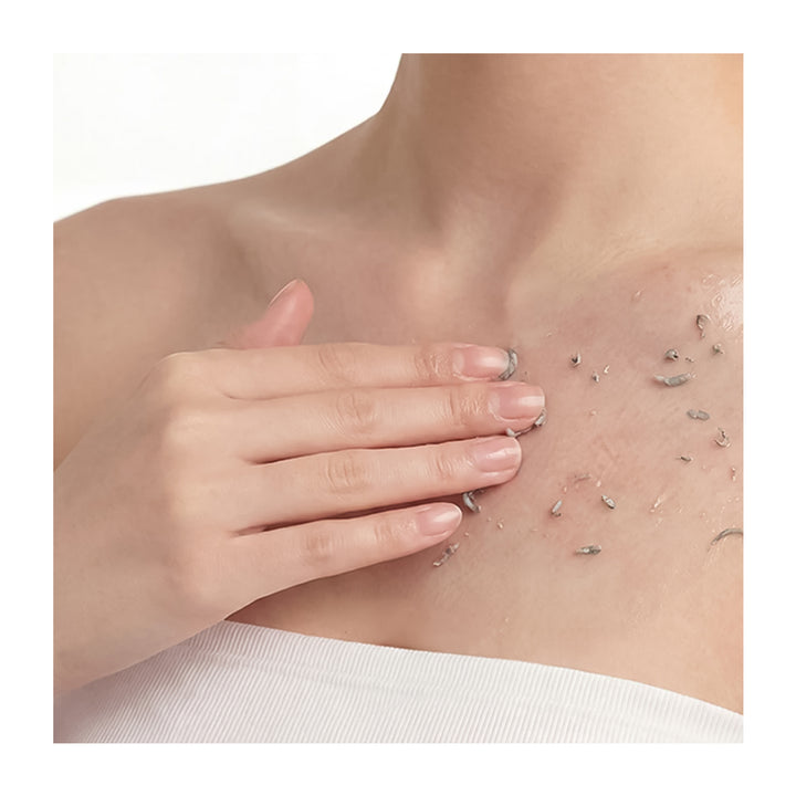 Hand touching skin with visible hair and pores on a white background