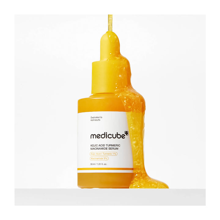 Yellow serum bottle with Medicube label on a white background