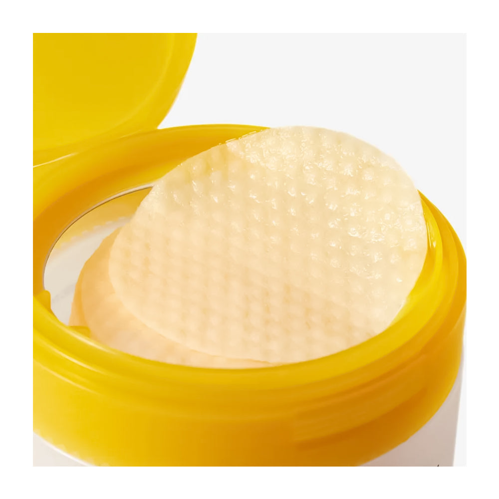 Yellow container with a white sponge inside on a white background