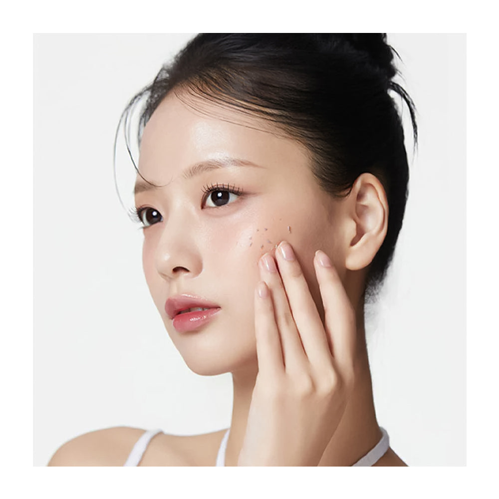 Woman touching her face with a white background