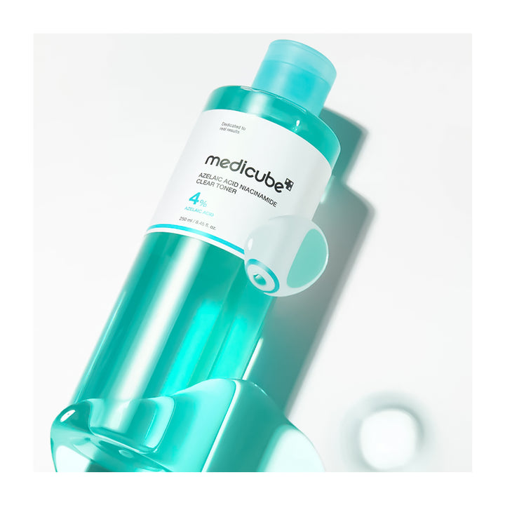 Turquoise bottle with white label on a light gray background