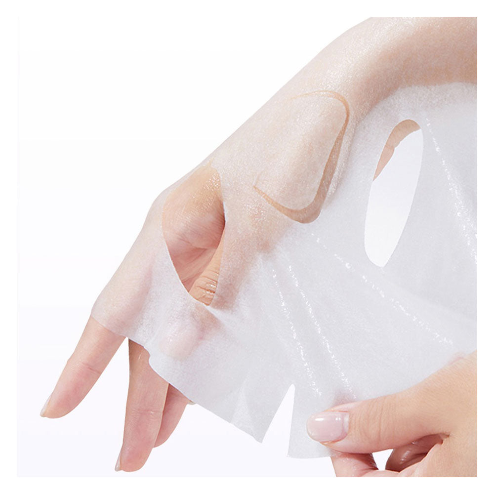 A close-up of a hand and wrist wearing a translucent white peel-off face mask against a clean white background.