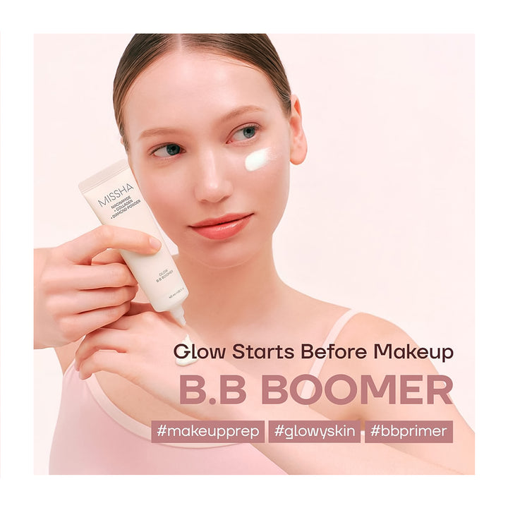 Woman applying BB cream with a cosmetic tube labeled &