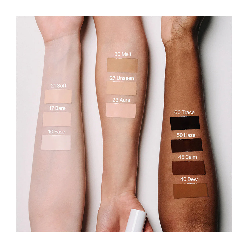 Three arms with makeup swatches labeled on a white background