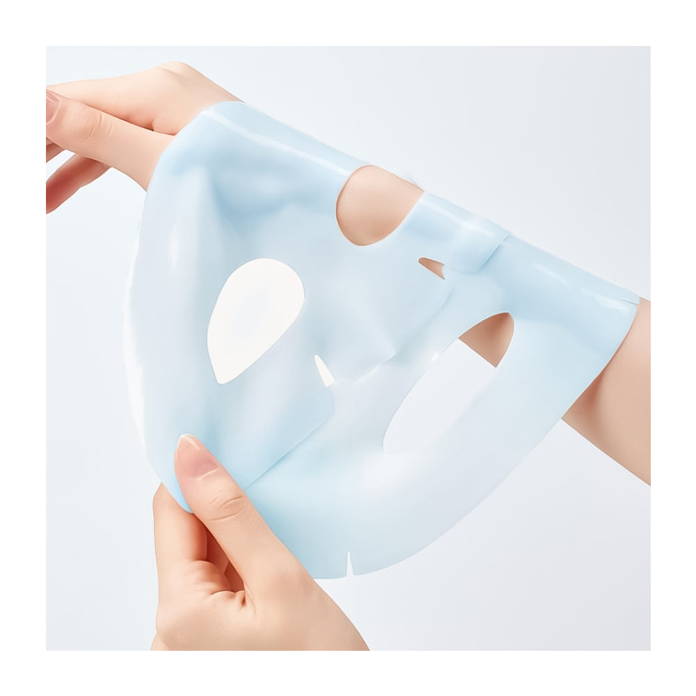 A translucent light blue silicone or plastic sheet mask being held by two hands against a clean white background.