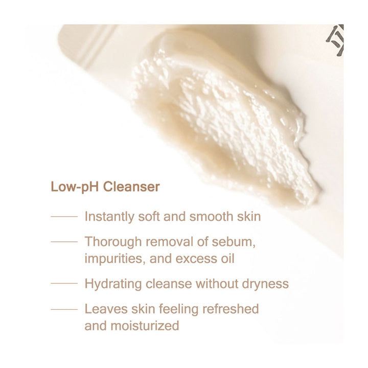 A close-up of a pale beige cleanser smear on a white surface, with text below reading &