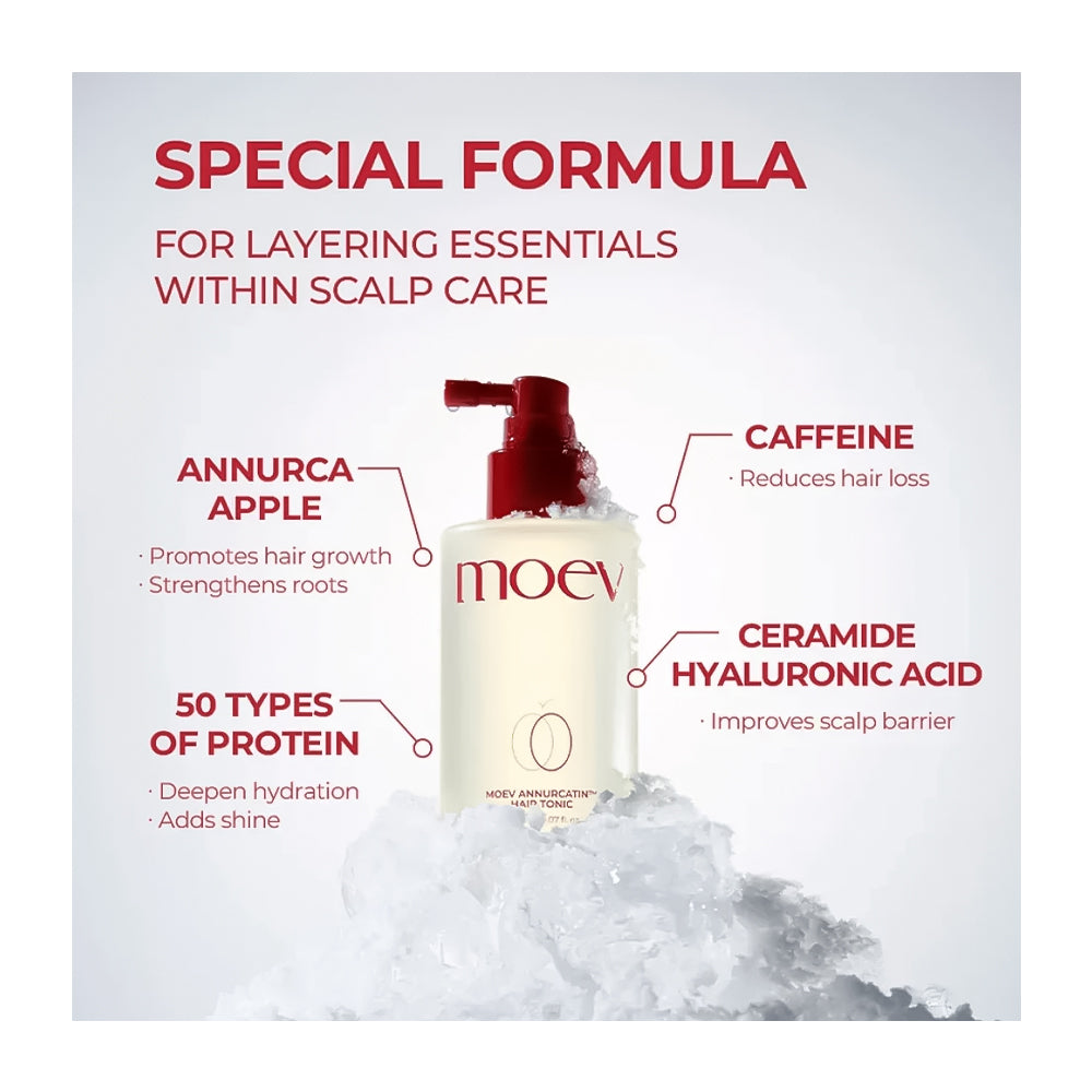 Moev Hair Annurca Apple Scalp Care Hair Tonic bottle with a red pump dispenser, displayed on a pile of ice with text callouts highlighting key ingredients like caffeine, annurca apple, and ceramide hyaluronic acid.