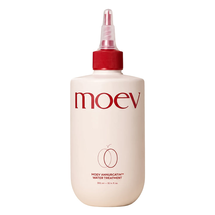 A bottle of Moev Hair Ambulator Water Treatment with a cream-colored body, red cap, and red branding on a white background.