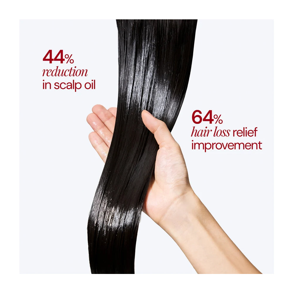 A hand holding a long, glossy, black hair bundle against a light gray background, with red text overlays stating &