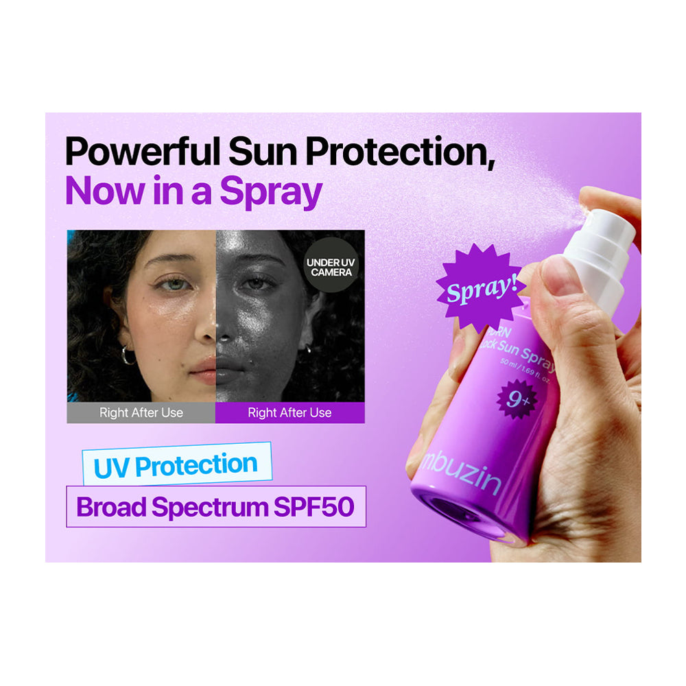 A hand holding a purple numbuzin UV Sun Spray bottle with a white nozzle, spraying mist. The background is light purple with promotional text reading 'Powerful Sun Protection, Now in a Spray', 'UV Protection', and 'Broad Spectrum SPF50'.