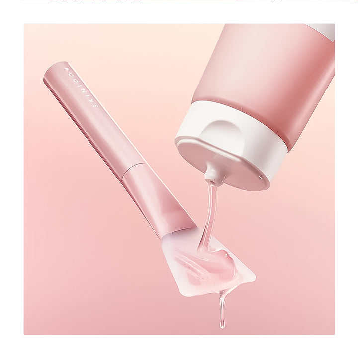 Pink skincare device dispensing a gel onto a white pad against a pink background