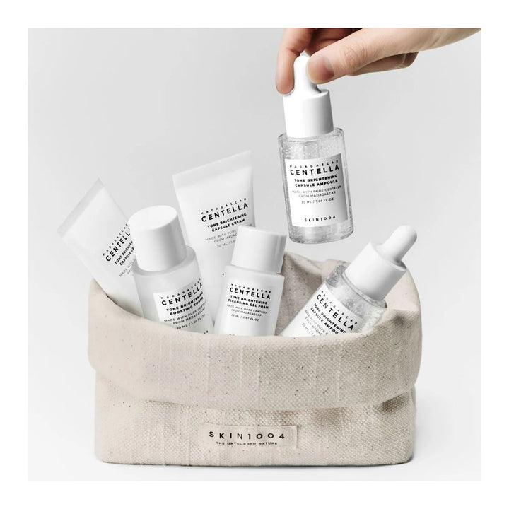 Collection of Cenella skincare products in a beige basket on a light gray background