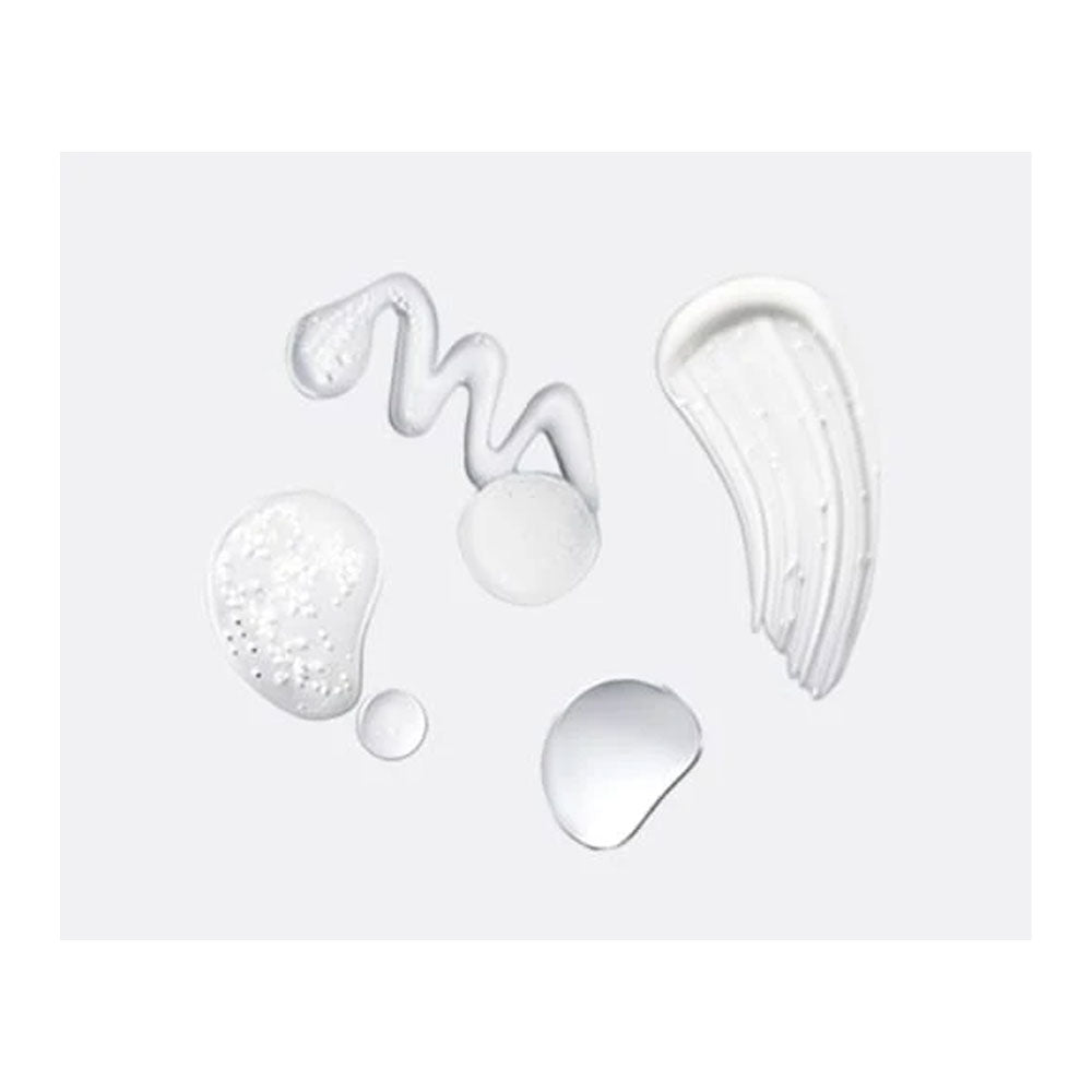 White cosmetic product swatches on a light gray background