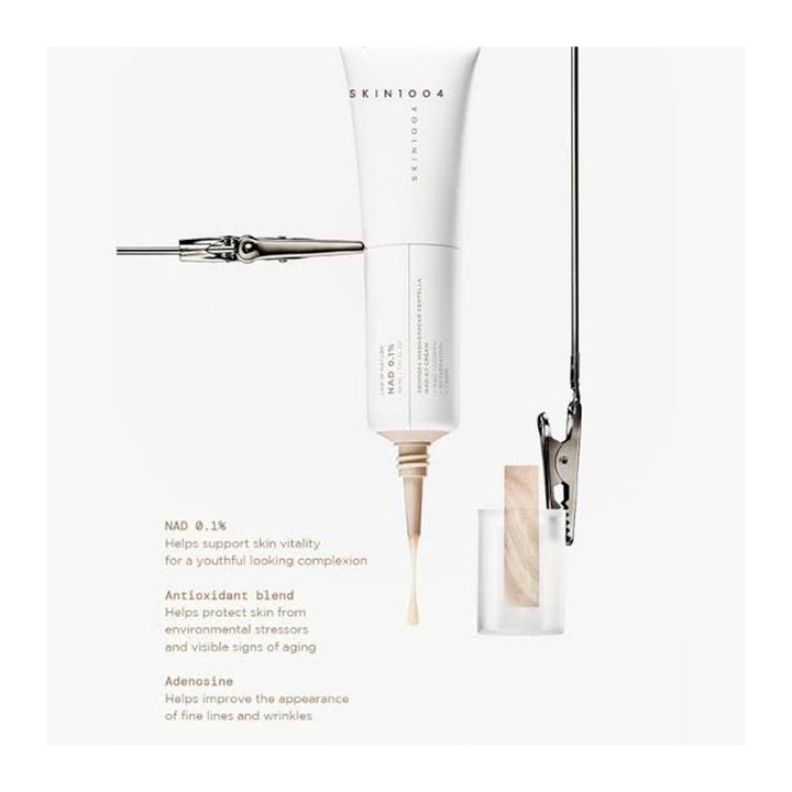 SKIN1004 NAD+ 0.1% Hyalu-Cica Cream, shown as a white squeeze tube with a gold applicator tip dispensing cream, alongside a clear glass jar with a wooden applicator and text detailing its benefits.