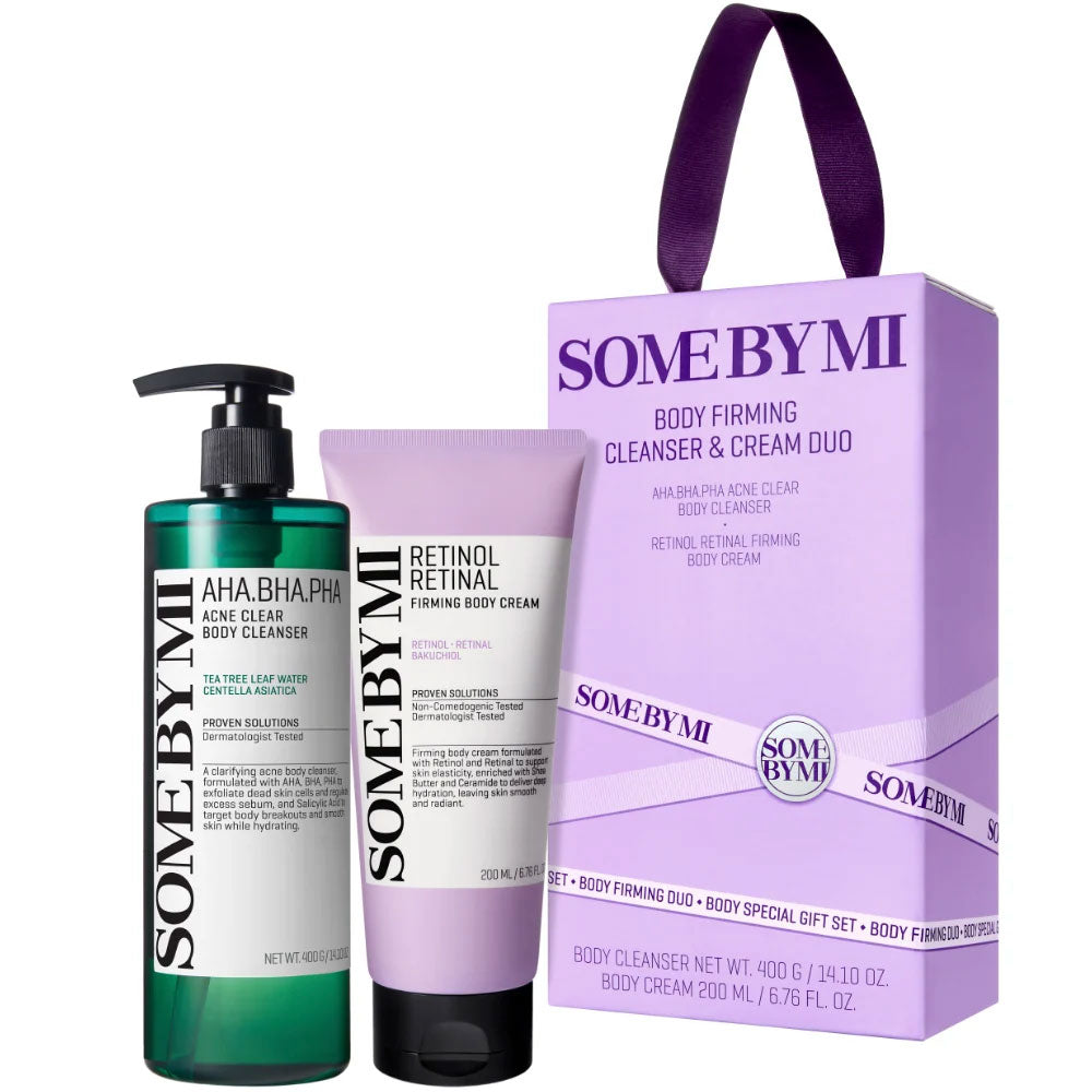 SOME BY MI body firming cleanser and cream duo set, featuring a green pump bottle of acid cleanser, a lavender cream tube, and a matching lavender gift box with a purple handle on a white background.
