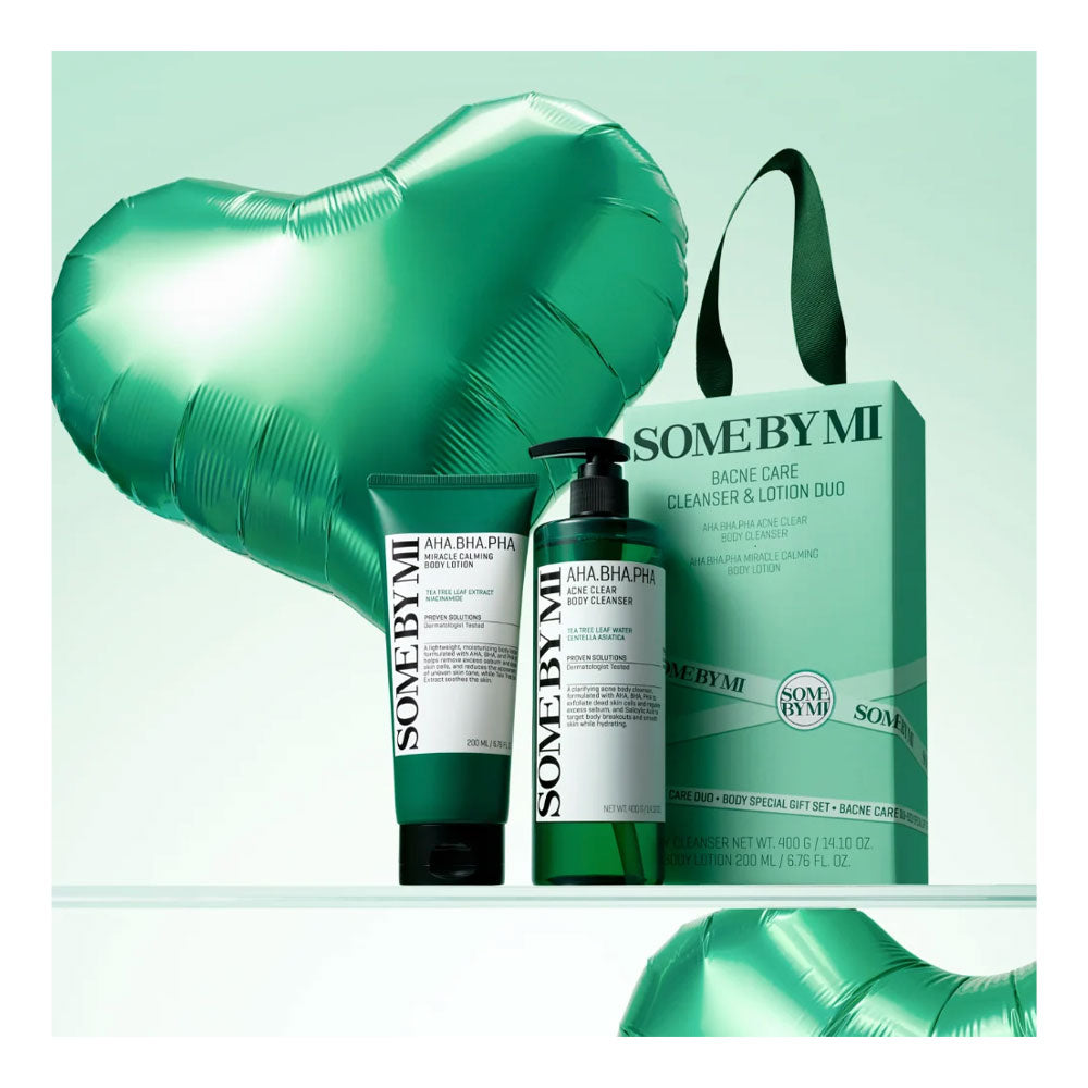 SOME BY MI AHA-BIOTA PHO Cleanse &amp; Lotion Duo gift set, featuring a green and white cleanser bottle, a green and white lotion tube, a matching green gift bag, and a large metallic green heart-shaped balloon against a mint green background.