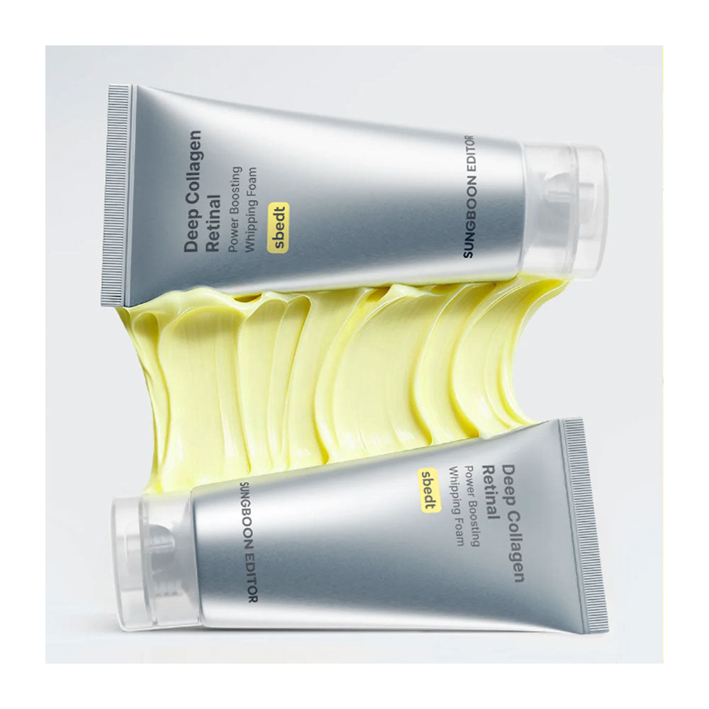 Two silver tubes of Sungdoon Editor Deep Collagen Retinol Power Boosting Whipping Cream with a yellow cream smear in the background, on a light gray studio background.