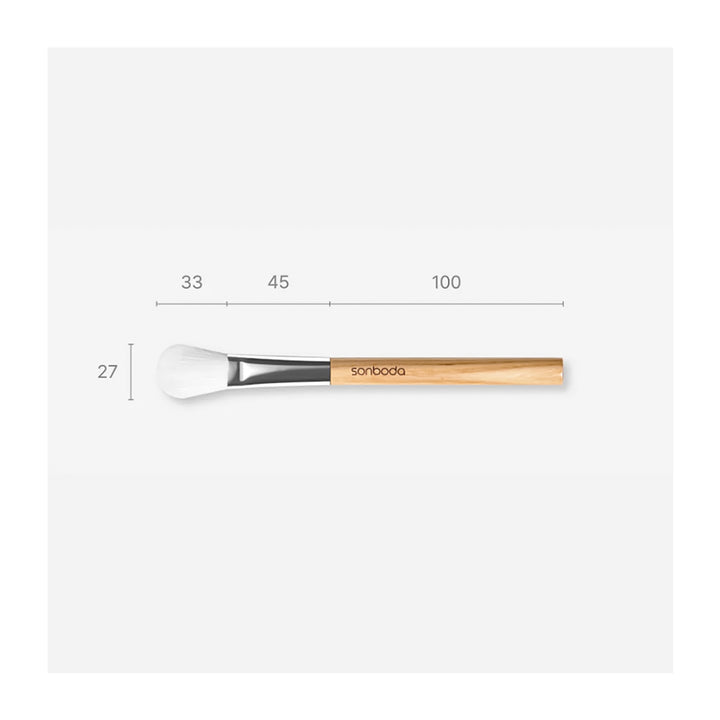 A makeup brush with a light wood handle and white bristles, shown horizontally with dimension labels above it: 33, 45, 100, and 27.