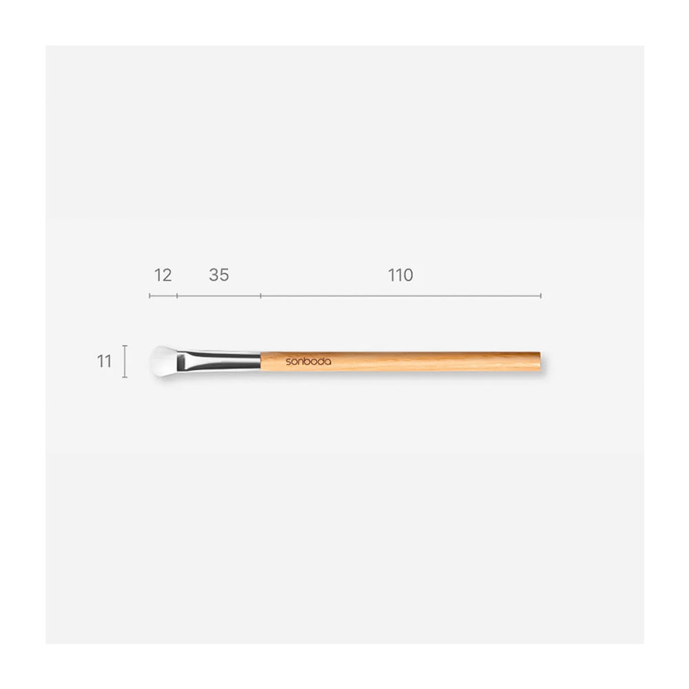 A makeup brush with a light wood handle and black ferrule, shown horizontally with dimension markings above it indicating 12, 35, 110, and 11.