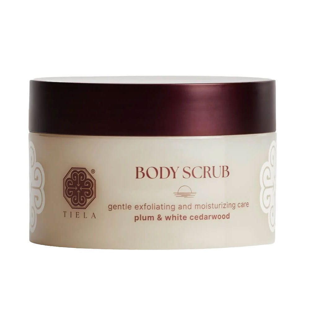 Tieléa Plum &amp; White Cedarwood Body Scrub in a cream-colored jar with a dark plum-brown lid, shown on a plain white background.