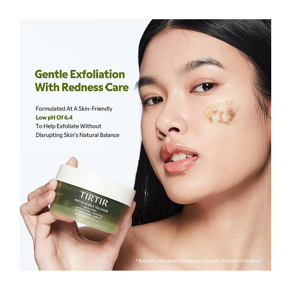 A woman holds a jar of TIRTIR Gentle Exfoliating Redness Care Peachy Sugar Scrub against a clean white background with product text. The woman has a small amount of the scrub applied to her cheek.