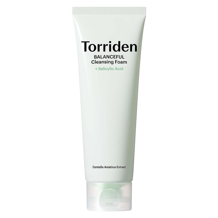 A white squeeze tube of Torriden Balanceful Cleansing Foam with Salicylic Acid, featuring black and green text, on a solid white background.