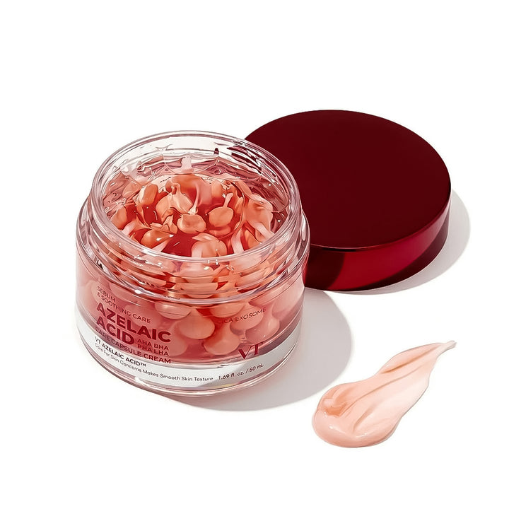 Skincare cream jar with pink cream and red lid on a white background