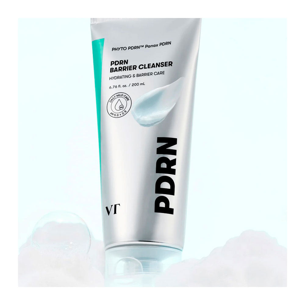 A 200 mL squeeze tube of PDRN Barrier Cleanser by Photo PDRN, featuring a metallic silver body with a teal accent stripe and bold black text, set against a light blue background with soft white foam at the base.