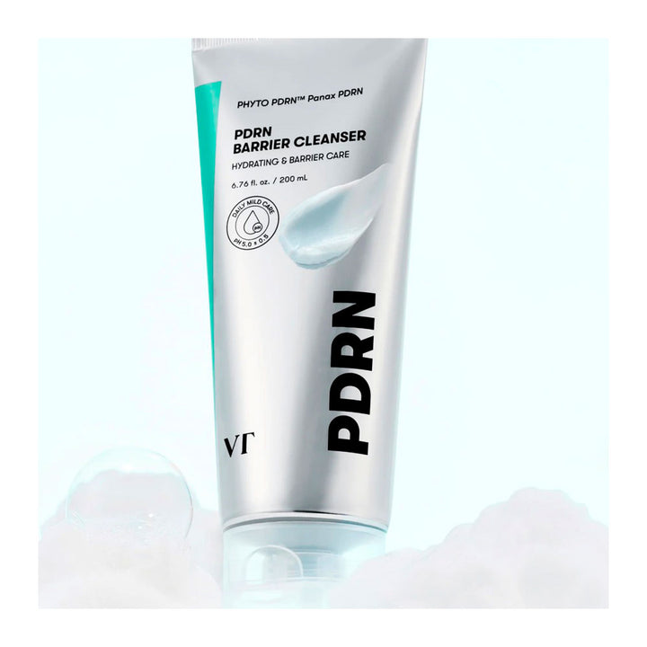 A 200 mL squeeze tube of PDRN Barrier Cleanser by Photo PDRN, featuring a metallic silver body with a teal accent stripe and bold black text, set against a light blue background with soft white foam at the base.
