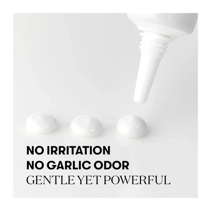 A white squeeze tube dispensing three small dollops of white cream on a light gray background, with bold black text reading &